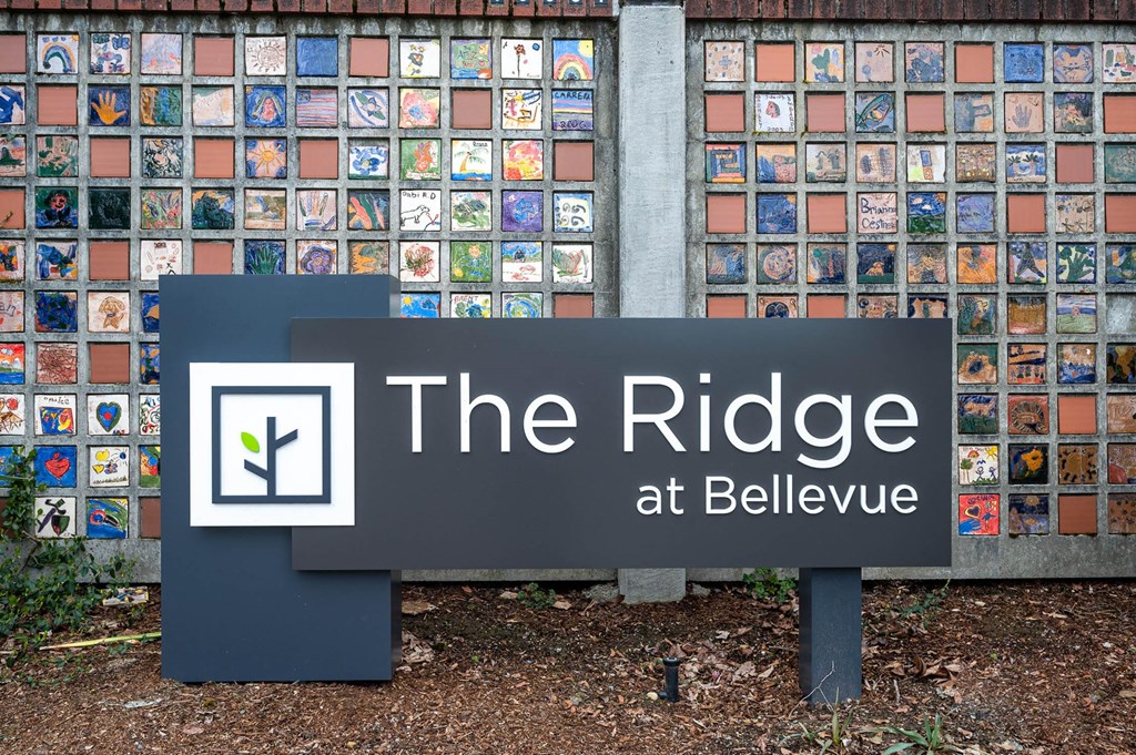 the ridge sign in front of a wall of tiles